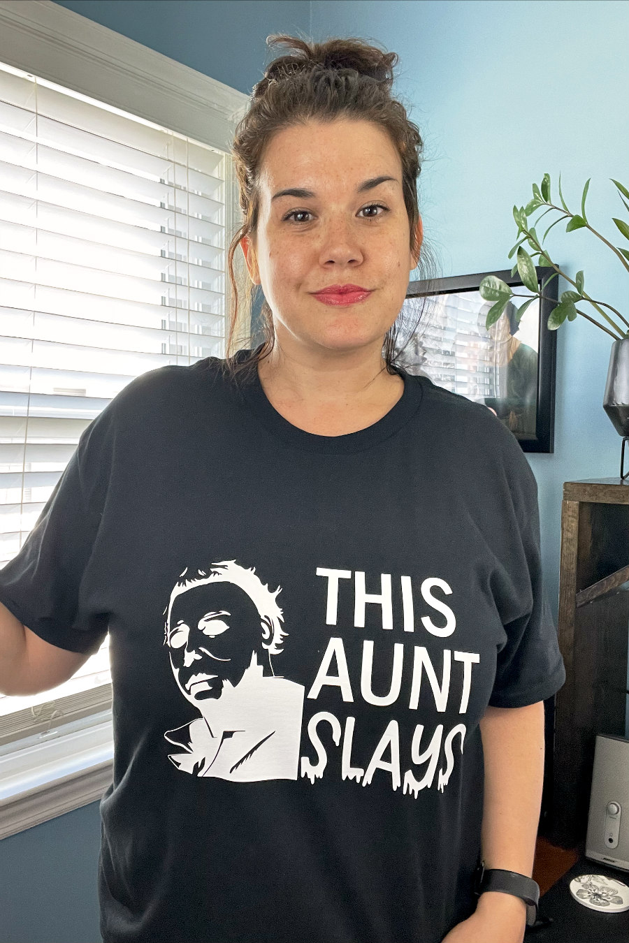 Jessica Holoka wearing This Aunt Slays Shirt designed with Cricut iron-on vinyl.