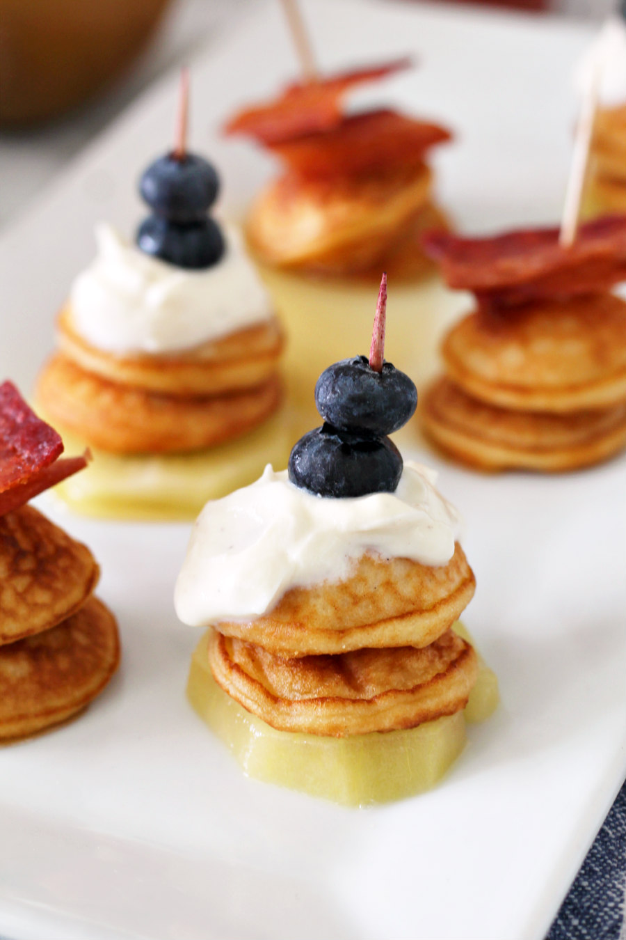 Close up photo of Sweet and Savory Mini Pancake Stacks on a serving dish.