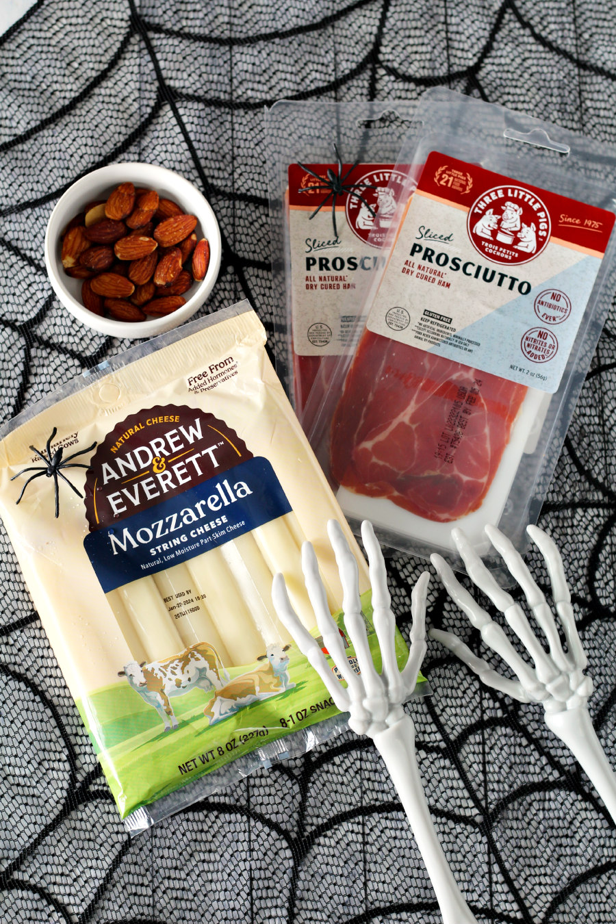Ingredients from Hungryroot including almonds, mozzarella string cheese, and sliced prosciutto.