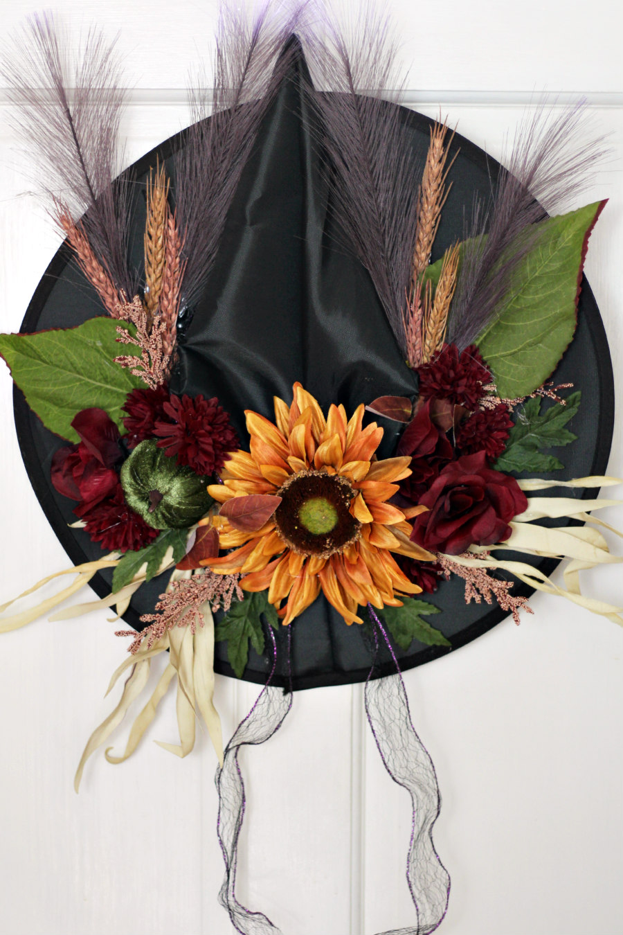 Fall Floral Witch Hat hung on back of a door.