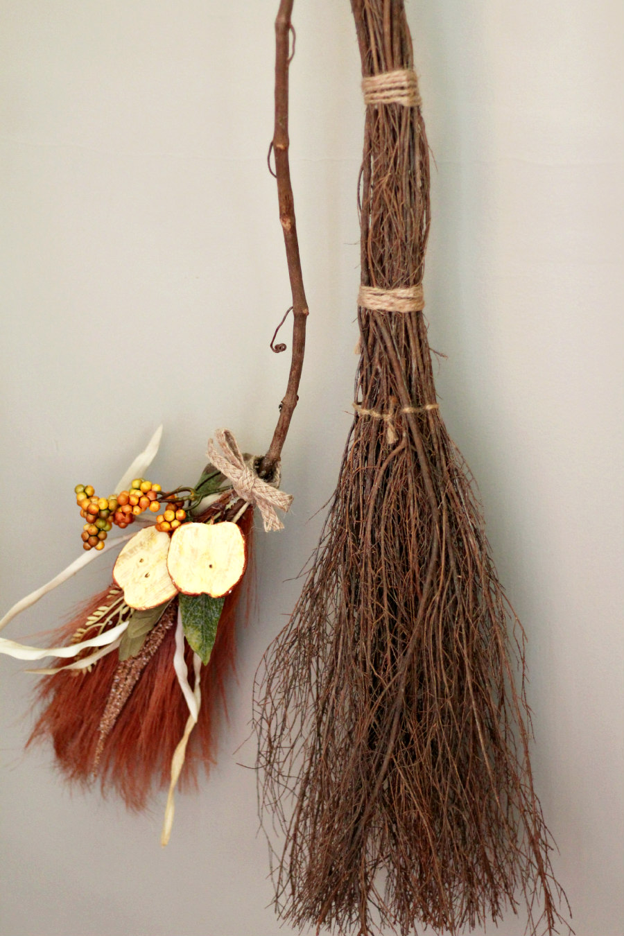 Pampas Grass Witch's Broom hung next to cinnamon broom.