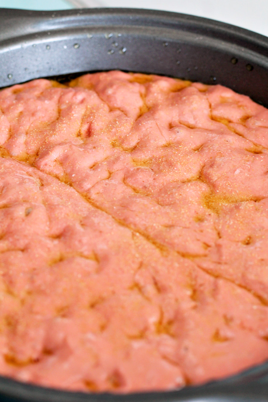 Halloween Brain Focaccia Bread dough dimpled in pan to look like a brain.